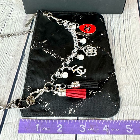 CHANEL black nylon pouch crossbody with chain, bag charm and authenticit⦠- Picture 12 of 12